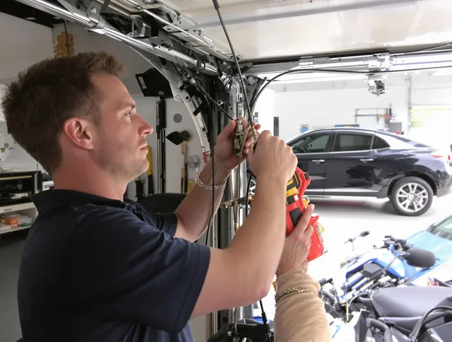 St. Simons Garage Door Repair safety certified technician performing cable replacement in St. Simons