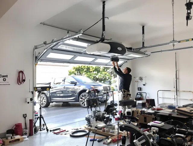 St. Simons Garage Door Repair specialist installing smart garage door opener system in St. Simons home