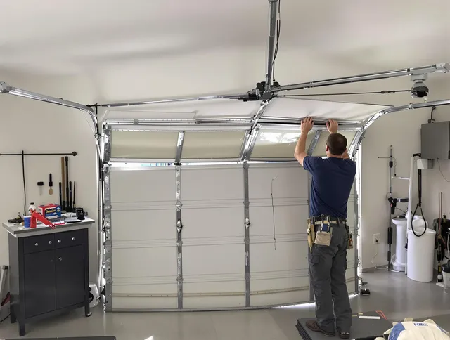 St. Simons Garage Door Repair specialist performing precise section replacement on St. Simons garage door